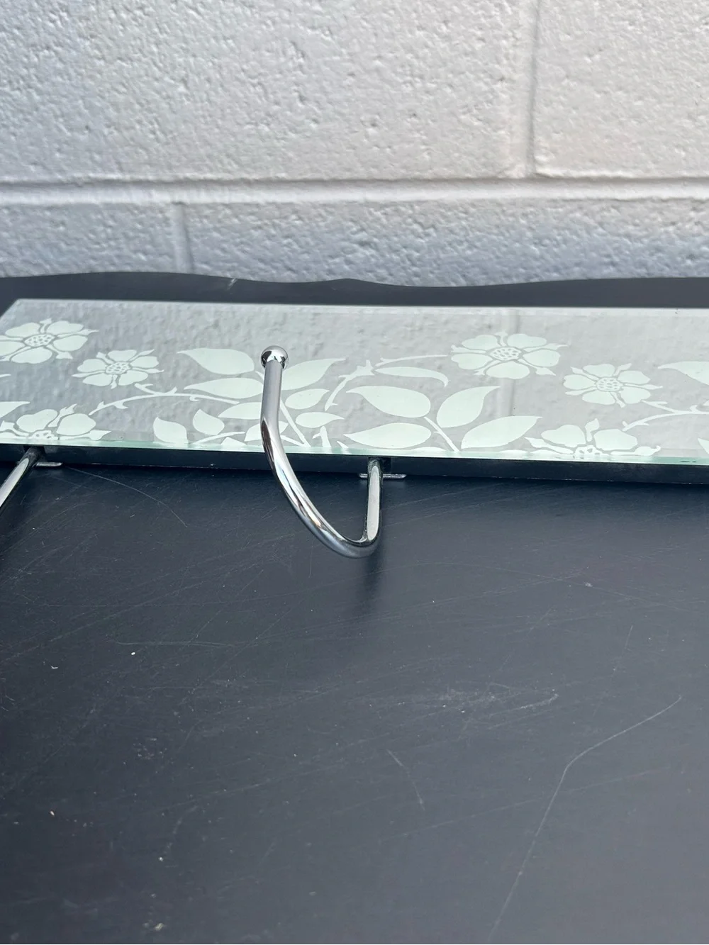 glass mirror coat rack featuring three chrome metal hooks and a delicate frosted